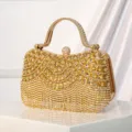 Luxury gold rhinestone evening clutch bag with sparkling crystal fringe and elegant handle. - Gold