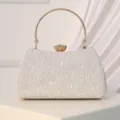 Elegant women's evening clutch bag with golden round handle and lace texture for party. - Silver