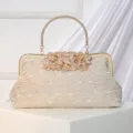 Elegant vintage lace evening handbag with metallic round handle and rhinestone leaf clasp. - Champagne
