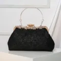 Elegant black glitter evening clutch bag with gold metal frame, rhinestone clasp and round handle. - Black