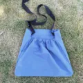 Blue outdoor foraging bag for fruit picking, adjustable black strap, durable fabric. - Blue