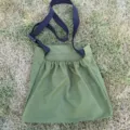 Outdoor foraging harvest bag detail view showcasing green fabric and adjustable black strap. - Army Green