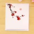 Chinese style greeting card with plum blossom design and red blessing seal for various holidays. - Plum