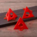 Close-up detail of red plastic painter pyramids stands, showing texture, hole design and workbench scene. - Single Pack Without Packaging / Red