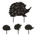 Close-up details of the black acrylic hedgehog garden stakes showcasing cute silhouette designs. - 1 Large + 3 Small Hedgehogs