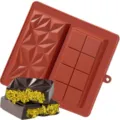 Silicone chocolate mold with geometric diamond and bar patterns for making Dubai pistachio treats. - Brick Red Diamond Grid