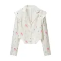 Detailed view of the white floral blazer jacket with pink flowers and chic lapel collar. - S / Floral Blazer