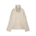 Close-up details of the high funnel neck, double-breasted buttons, and sleeve strap features. - XS / Milky White