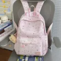 Pink star print casual backpack for women, cute school bag with front pocket and pendant. - With Charm / Pink