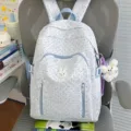 Light blue polka dot cartoon backpack for girls, cute rabbit charm large capacity school bag. - With Charm / Blue