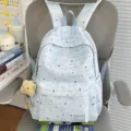 Light blue star print school backpack for casual daily commute and stylish student travel. - With Charm / Blue