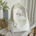 Light green polka dot backpack with cute bow ribbons and star charm for daily school use. - With Charm / Green