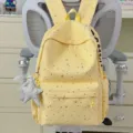 Gelber Sternen-Schulrucksack mit Sternanhänger und Seiten-Logoprint für den Alltag. - Mit Anhänger / Gelb