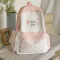Pink and white polka dot backpack for girls, cute school bag with bow and plaid front pocket. - With Charm / Pink