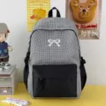 Minimalist black and white plaid backpack with a cute bow, perfect for daily commute and school. - No Pendant / Black