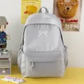 Sac à dos à carreaux minimaliste avec nœud, grande capacité pour les cours et le travail. - Sans pendentif / Gris
