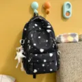 Black printed backpack for women, stylish school bag with star and heart patterns daily use. - With Charm / Black
