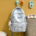 Light blue printed canvas backpack variant with cute star charm and front brand patch for daily use - With Charm / Blue