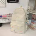 Ins style campus backpack with colorful star embroidery and large capacity for daily travel use. - With Charm / L / Off White
