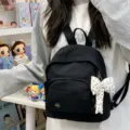 Black mini backpack for women, cute polka dot bow pendant, casual daily travel bookbag. - With Charm / Black