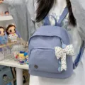 Mini cute blue backpack for women, casual nylon daypack with polka dot bow pendant. Perfect. - With Charm / Blue