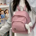 Pink mini backpack for women, cute casual small daypack with bow pendant and front pocket. - With Charm / Dark Pink