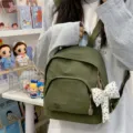 Green mini backpack for women, cute casual canvas daypack with polka dot bow pendant. - With Charm / Green