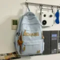 Light blue casual student backpack with large vintage letters, stylish large capacity travel bag. - With Charm / Blue