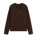 Detailed view of the dark brown V-neck cable knit sweater, showing fine texture and long sleeves. - S / Coffee