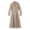 Detailed view of the sheer textured khaki shirt dress featuring long sleeves and lapel collar. - Light Coffee