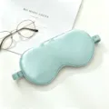 Mint green silk sleep mask, breathable light-blocking design for comfortable portable rest. - Jade Green