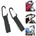 Close-up details of stroller hooks featuring strong black straps and metal carabiner clips. - Black