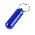 Blue aluminum pill bottle keychain, portable mini pill container detail view, outdoor EDC gear. - Blue