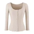 Close-up of ribbed knit cardigan featuring delicate lace trim scoop neck and front buttons. - S / Tops / Oatmeal