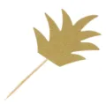 Closeup of a gold glitter pineapple leaf cake topper with a wooden toothpick stick for party. - Gold