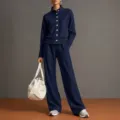 Detailed view of the stylish navy blue cardigan and matching wide-leg trousers outfit set. - Navy Blue