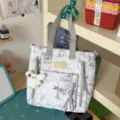 Casual printed canvas tote backpack with multiple zipper pockets for daily school use. - Shoulder Bag / With Pendant / Gray