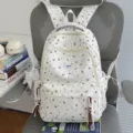 White canvas school backpack featuring cute red star print, multi-pocket casual daily daypack. - With Charm / Red Star
