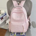 Pink star print casual backpack for school girls, cute lightweight book bag with multiple pockets. - With Charm / Pink