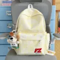 Yellow tie-dye backpack with cute plush dog pendant, casual stylish school bag for daily use. - With Charm / Yellow