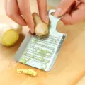 Stainless steel ginger garlic grater detail, manual kitchen tool for easy food prep and grinding. - Standard Type