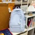 Light blue minimalist casual backpack with cute pendant, perfect for daily school use. - With Pendant / Blue