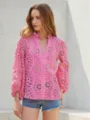 Detail view of the pink eyelet embroidered lantern sleeve blouse with ruffle stand collar. - Deep Pink