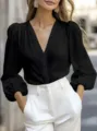 French V-neck black blouse with lantern sleeves, elegant professional office top detail. - Black