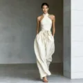 Beiger Halter Cross Jumpsuit, Resort Stil hohe Taille Bindeband weites Bein Mode. - S / Aprikose