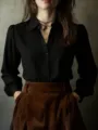 Elegant women's long sleeve black button down shirt with buttons for chic daily commuting style. - Black