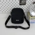 Lightweight casual crossbody bag for men and women, perfect for travel and outdoor sports. - Black