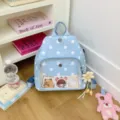 Zaino leggero blu a pois bianchi con tasca frontale trasparente per donna stile casual. - Stile con Ciondolo / Blu