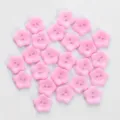 Close-up detail of cute pink flower-shaped two-hole buttons for crafting and DIY sewing accessories. - Flower Buttons / 13mm (24 Pieces/Pack) / Pink