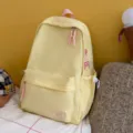 Casual solid color canvas backpack with cute bow embroidery, large capacity daily school bag. - No Pendant / Yellow